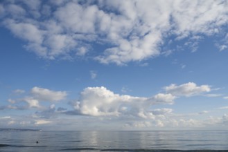 View across the Baltic Sea towards the chalk coast, sky with white clouds, Binz, seaside resort,