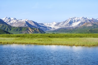 Lake and picturesque mountain landscape with Gulkana glacier and summit Icefall Peak, Richardson