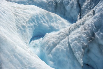 Waterfall in a crevasse on the ice of Root Glacier, Wrangell St. Elias National Park, Alaska, USA