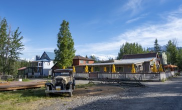 Vintage car and historic building, McCarthy, Wrangell St. Elias National Park, Alaska, USA