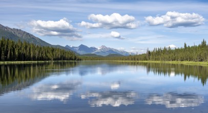 Mountains are reflected in idyllic Crystal Lake, McCarthy Highway, Wrangell St. Elias National