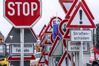 Storage for traffic signs in the yard of a road maintenance department, various signs with