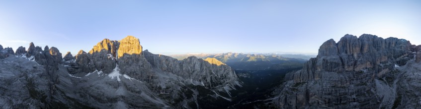 Aerial view, alpine panorama, Cima Tosa and rocky peaks at sunrise with alpine glow, picturesque
