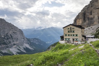 Rifugio Maria E Alberto Ai Brentai mountain hut and rocky peak, Brenta, Trentino, Italy