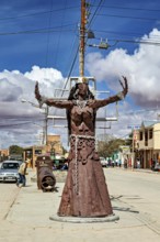 Metal sculpture on an urban street under a blue sky, The city of Uyuni in Bolivia