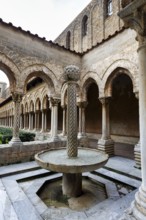Famous Benedictine monastery cloister, decorated columns and fountains, Cathedral of Monreale,