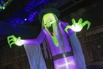Illuminated scary figure at Halloween Run, night run in the Duisburg-Nord Landscape Park, Duisburg,
