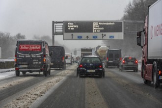 The onset of winter in North Rhine-Westphalia, heavy snowfall, driving on the A3 motorway near