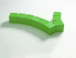 9 green wooden cubes against a white background