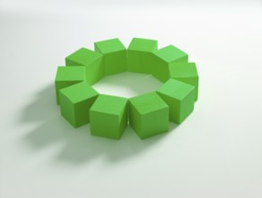 10 green wooden cubes against a white background