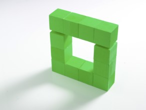12 green wooden cubes against a white background
