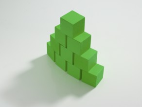 10 green wooden cubes against a white background