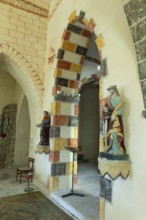 Painted arch in red, yellow and black. St Aignan's Church of Begues. Allier department. Auvergne