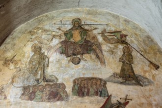 Issoire. Pillar (The Annunciation made to Mary) . The figures are illuminated by colorful light