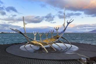 Sólfar sculpture, Solfar, sunrise, steel Viking ship by Jón Gunnar Árnason, evening with a view of