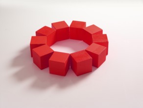 10 red wooden cubes against a white background