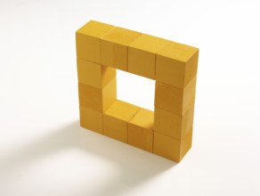 12 yellow wooden cubes against a white background