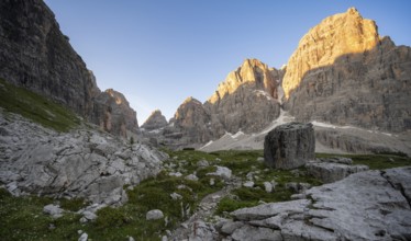 Picturesque mountain landscape in Val Brenta Alta at sunrise, rocky peaks of Cima Tosa,