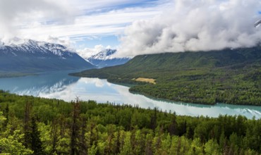 View of snowy mountains in spring and turquoise blue Kenai Lake, Slaughter Ridge Trail, Cooper