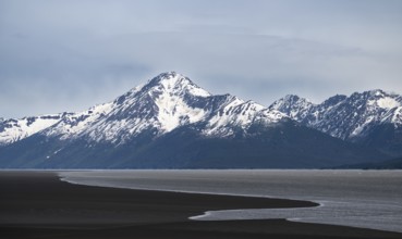 View of the Turnagain Arm estuary at low tide to the mountains of the Kenai Peninsula, Anchorage,