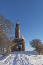 Holtenau lighthouse at the entrance of the Kiel Canal in winter, west bank of the Kiel Fjord,