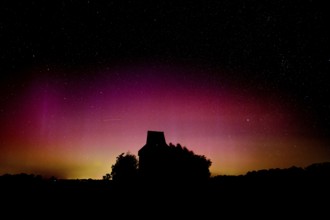Colourful polar lights over the EXPO observatory in front of a starry night, EXPO Observatory,
