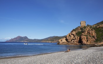 Genoese tower on the pebble beach of Porto, Ota, west coast of Corsica, Corse-du-Sud, Corsica,