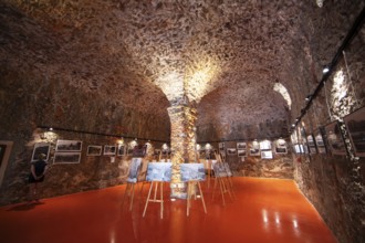 Exhibition at the Porto tourist office, a former Genoese weapons warehouse, interior view, Ota,
