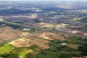The border between urban and agricultural areas is clearly visible from the air, as seen from an