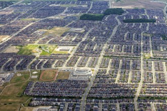A densely built residential area with a clearly recognizable street pattern seen from the air, view