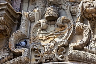 Highly detailed stone façade with a dove, reliefs on the Basilica of St. Francis in Lima in Peru