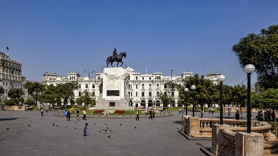Impressive equestrian monument in the middle of an open square with colonial buildings, Downtown