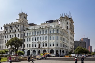 Beautiful colonial-style corner building with lively city life, Downtown Lima in Peru