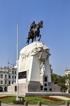 Impressive equestrian statue on an artfully designed monument against a sunny sky, Downtown Lima in