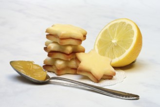 Lemon cookies, lemon and spoon with lemon curd