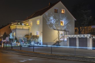 Illuminated Christmas decoration in the garden of a residential building, Nuremberg, Bavaria,