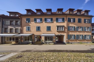 Row of houses, historic buildings, residential buildings, dormers, façade with windows, shutters