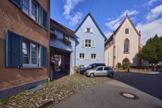 St. Martin parish church, houses, historic residential buildings, multi-family houses, road, curve,