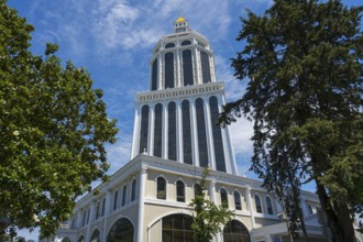 An imposing tower rises among trees under a clear blue sky, Sheraton Hotel, Batumi, Black Sea,