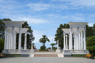 Classic column structure in the park with benches under a blue sky, colonnades, Batumi, Black Sea,