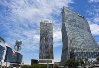 Two modern high-rise buildings with glass facades under cloudy sky, Radison Blue on the right and
