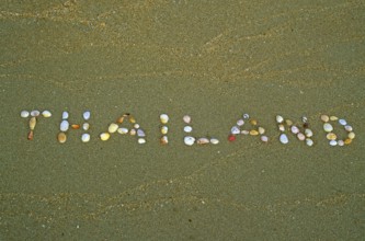 Thailand written with shells in the sand on the island of Ko Lanta, Thailand, December 2002,