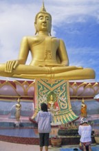 People praying, Big Buddha statue on the island of Ko Samui, Thailand, December 2002, vintage,