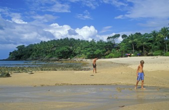 People, child, boy, beach at Coral Beach Resort on the island of Ko Lanta, Thailand, December 2002,