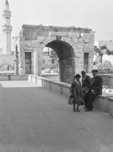 Roman arch of Marcus Aurelius Tripoli, Libya, North Africa 1956 with mosque minaret in background
