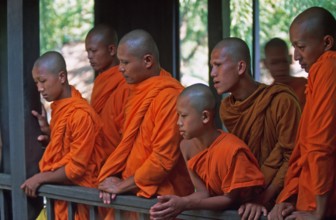 Monks watch performance, Samphran Elephant Ground and Zoo near Bangkok, Thailand, December 2002,