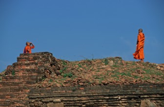 Monk takes photo of monk at Wat Phra Si Sanphet, Ayutthaya, Thailand, December 2002, vintage,