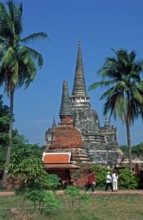 People, Chedis, palm trees at Wat Phra Si Sanphet, Ayutthaya, Thailand, December 2002, vintage,