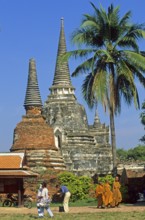 Monks, chedis, palm tree at Wat Phra Si Sanphet, Ayutthaya, Thailand, December 2002, vintage,