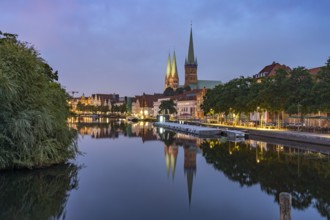 Old town with St. Mary's Church and St. Peter's Church and the Trave at dusk, Lübeck,